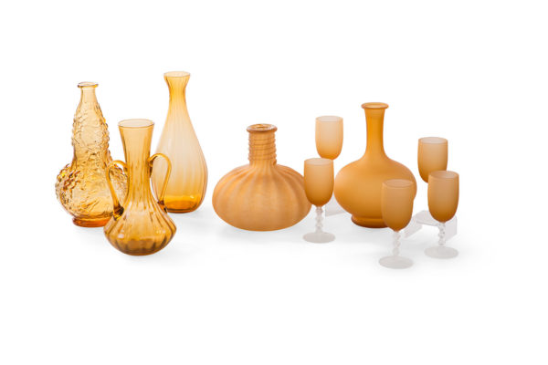 Studio photograph of golden glass vessels