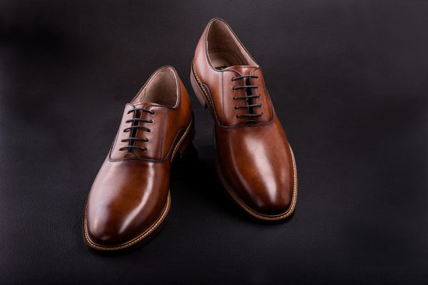 Commercial studio photograph of mens brown dress shoes