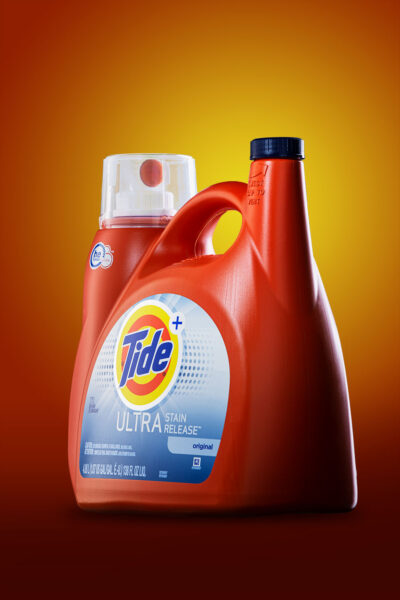 Tide Ultra Detergent on warm orange background