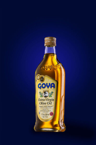 Goya extra virgin olive oil product shot on blue background