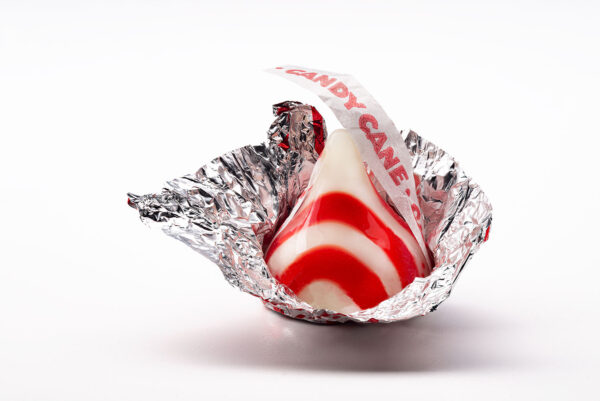 Candy Kiss sitting in a pealed back foil wrapper